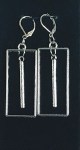 Silver color metal rectangles with a long metal bead hanging in the middle.